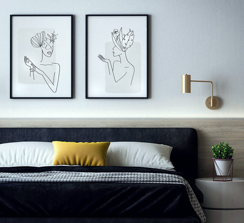 A pale room with two framed line drawings above the bed